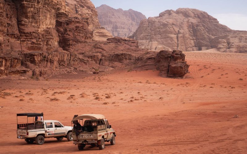 Wadi Rum Desert, Ma'an Governorate, Jordan - October 28 2023: Two off road Toyota vehicles with Beduin guides waiting for their passengers.